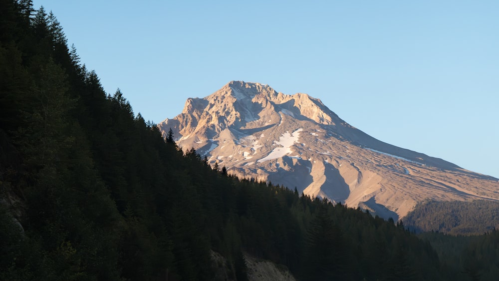 a mountain with a snow capped peak in the distance