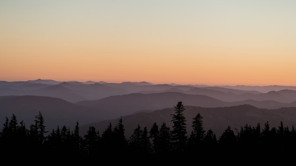 a view of a mountain range at sunset