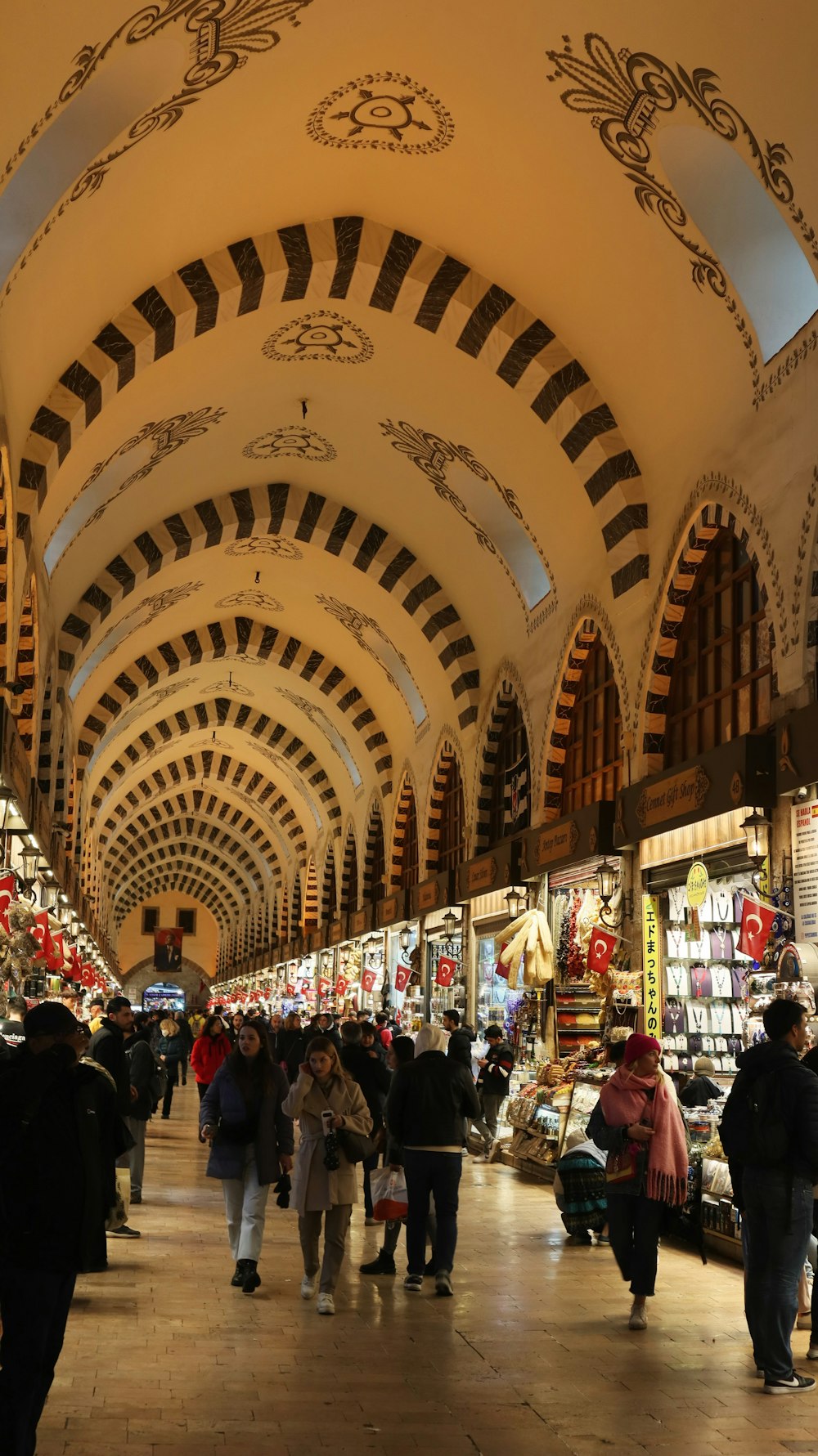 a group of people walking through a large building