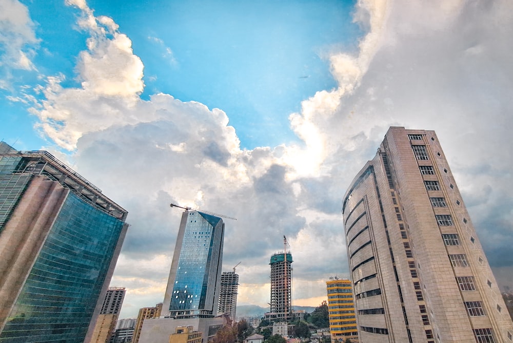 a group of tall buildings under a cloudy sky