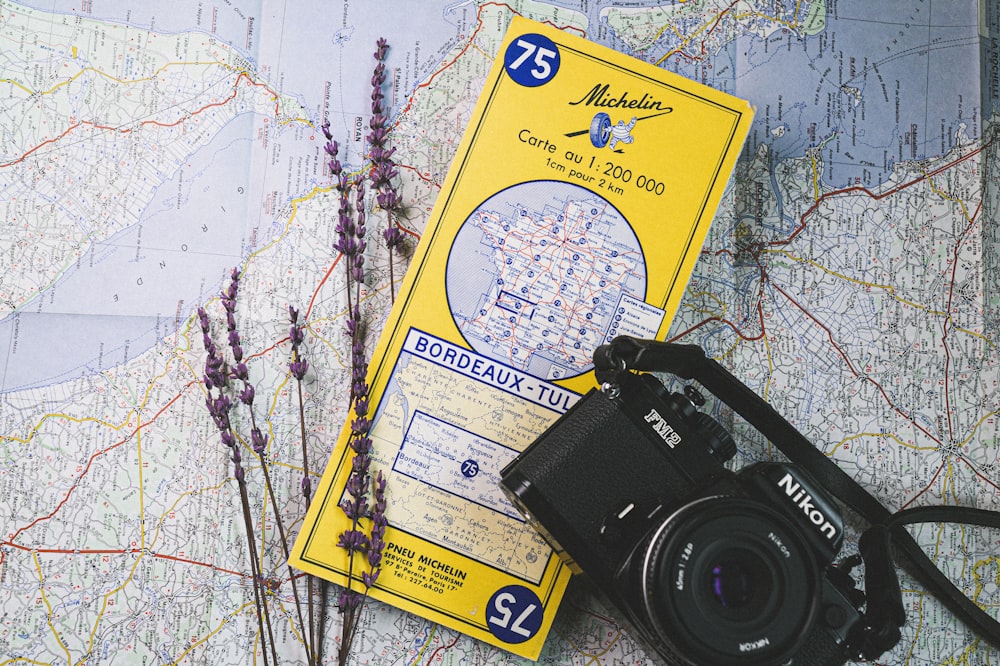 a camera and a map on a table