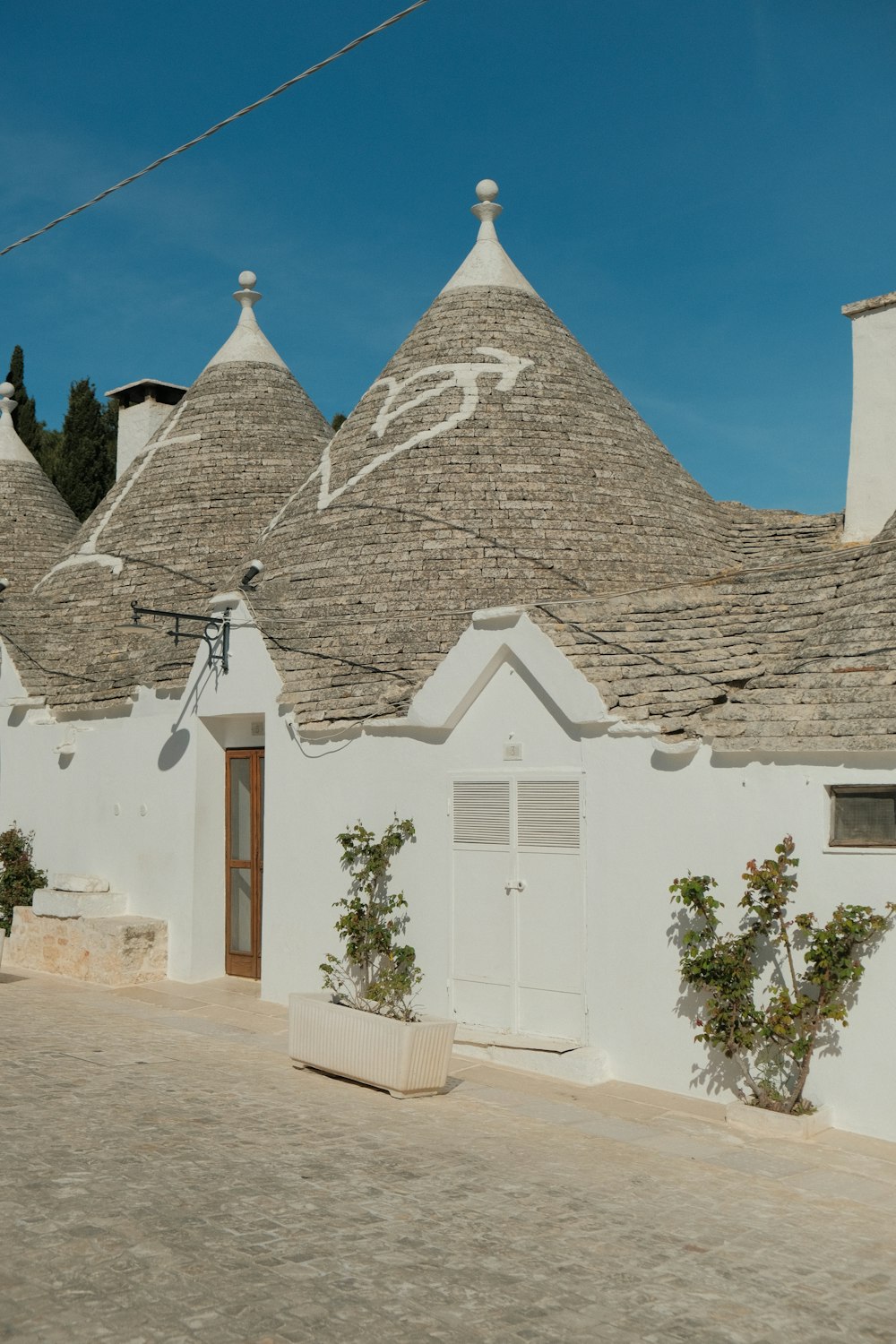 a white building with a lot of roof tops