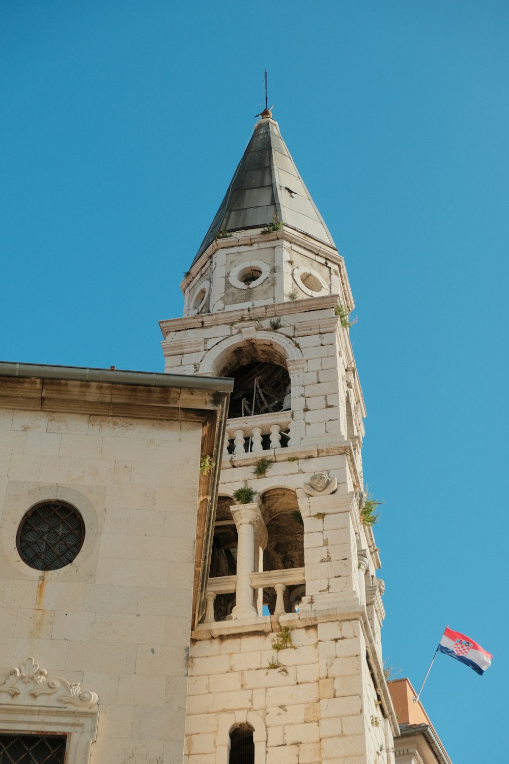 a tall tower with a clock on the top of it