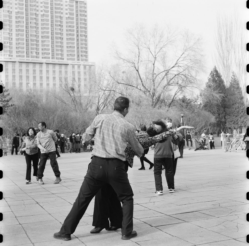 a group of people playing a game of frisbee