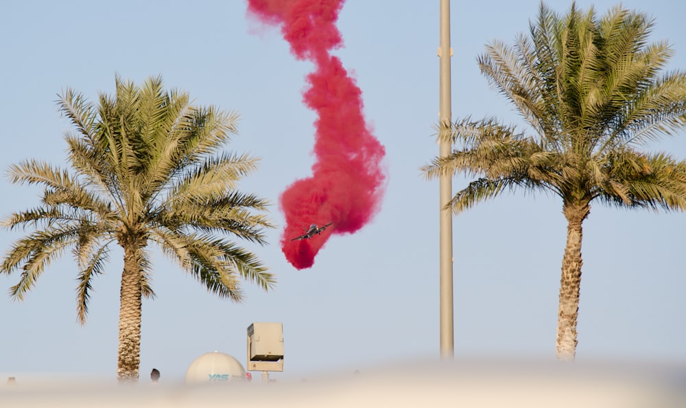 a pink smoke bomb is coming out of a pipe