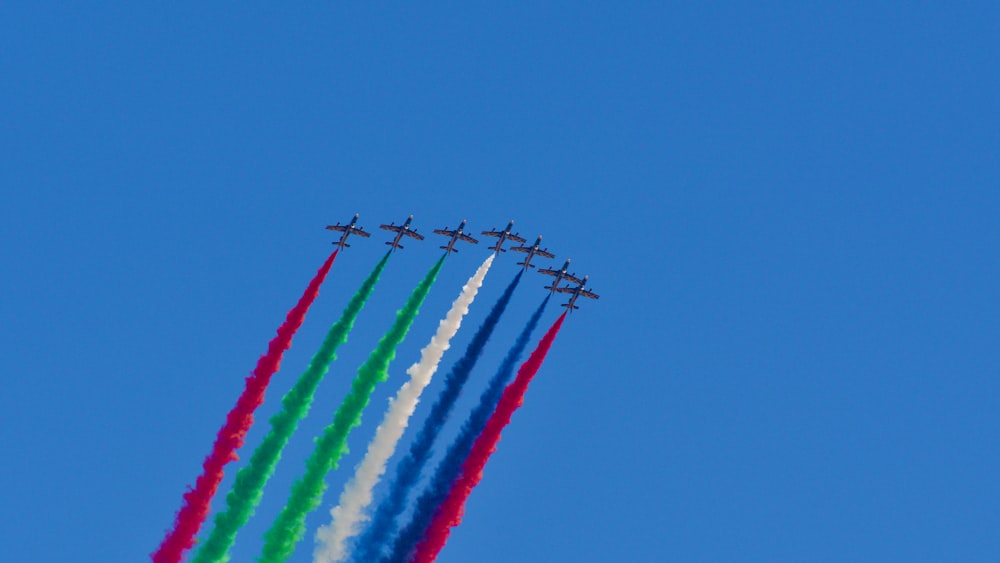 a group of airplanes flying in formation in the sky