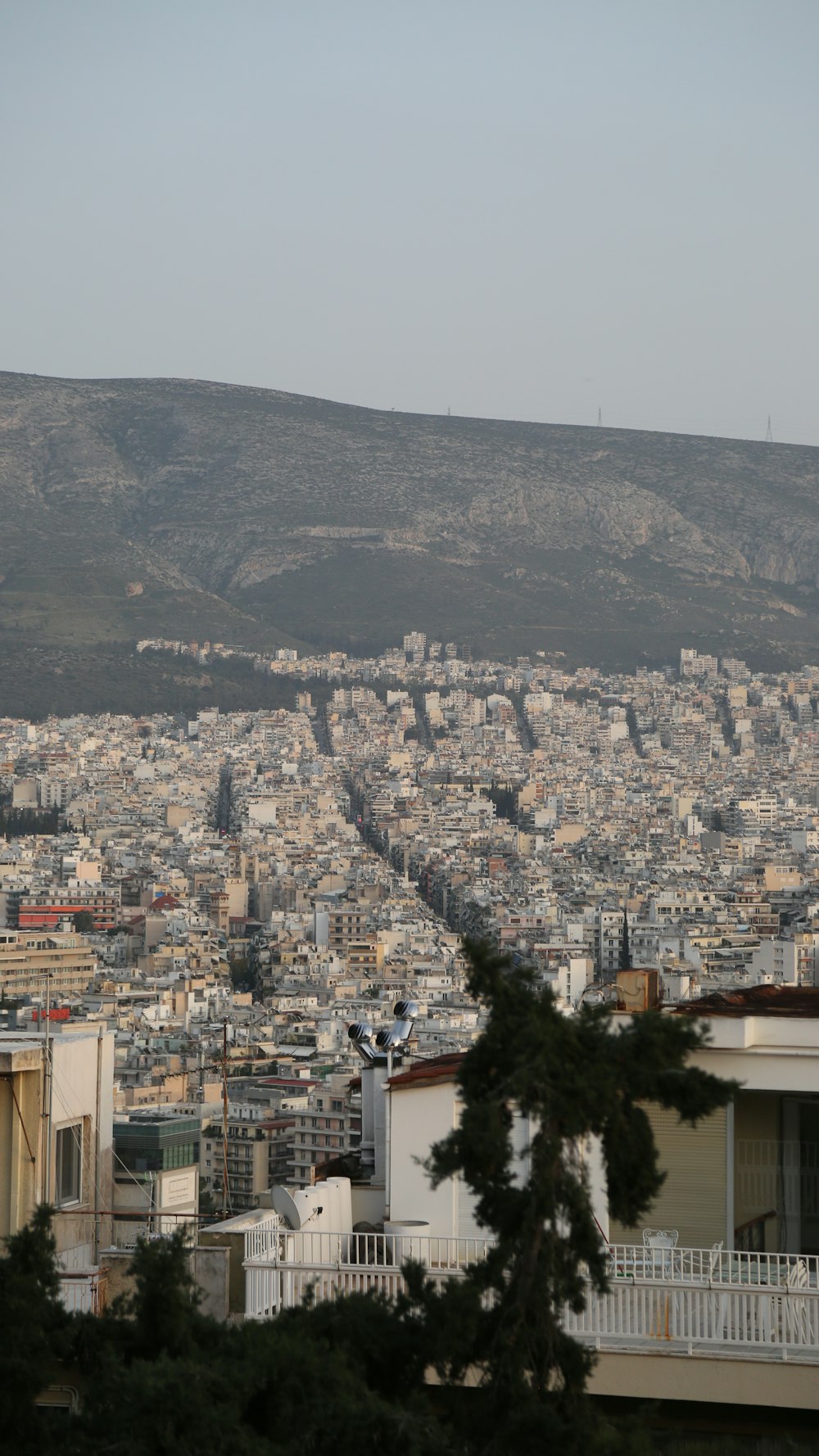 a view of a city with a hill in the background