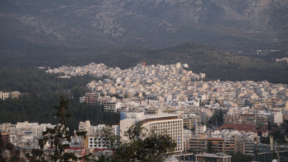 a view of a city with mountains in the background