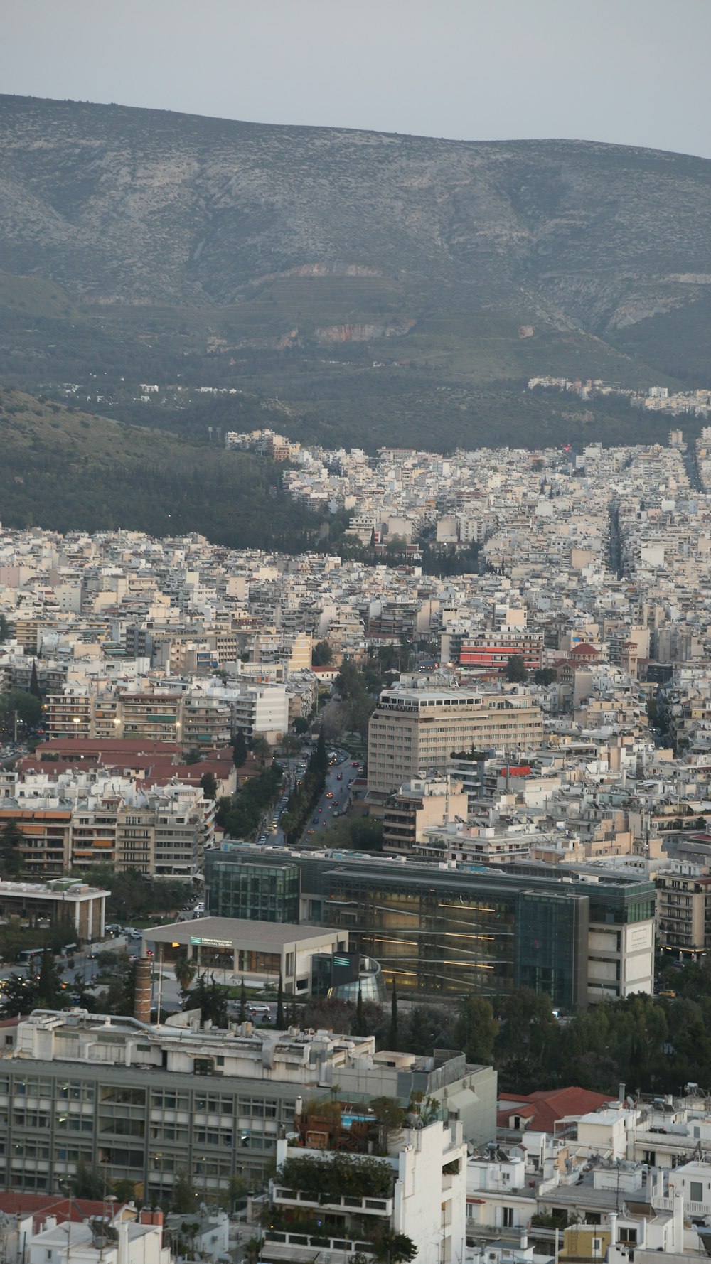 a view of a city with mountains in the background