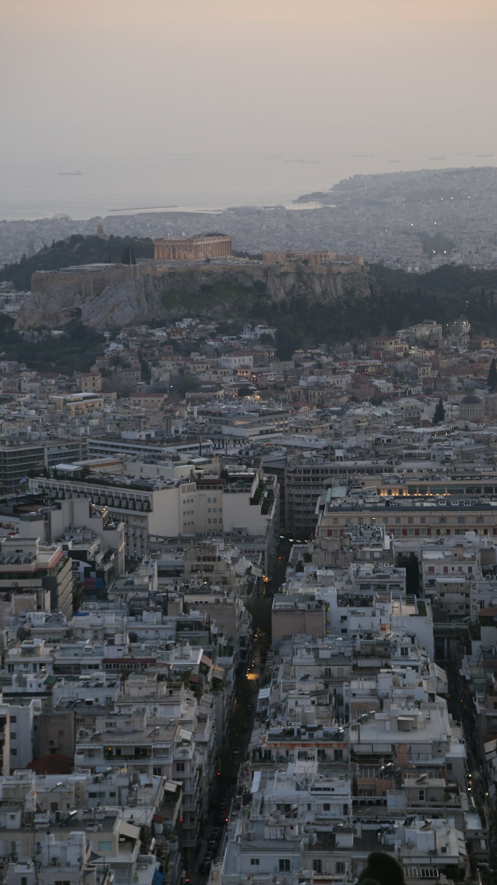 a view of a city from the top of a hill