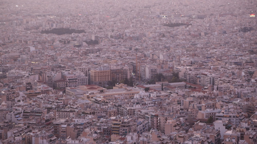 an aerial view of a city with lots of tall buildings