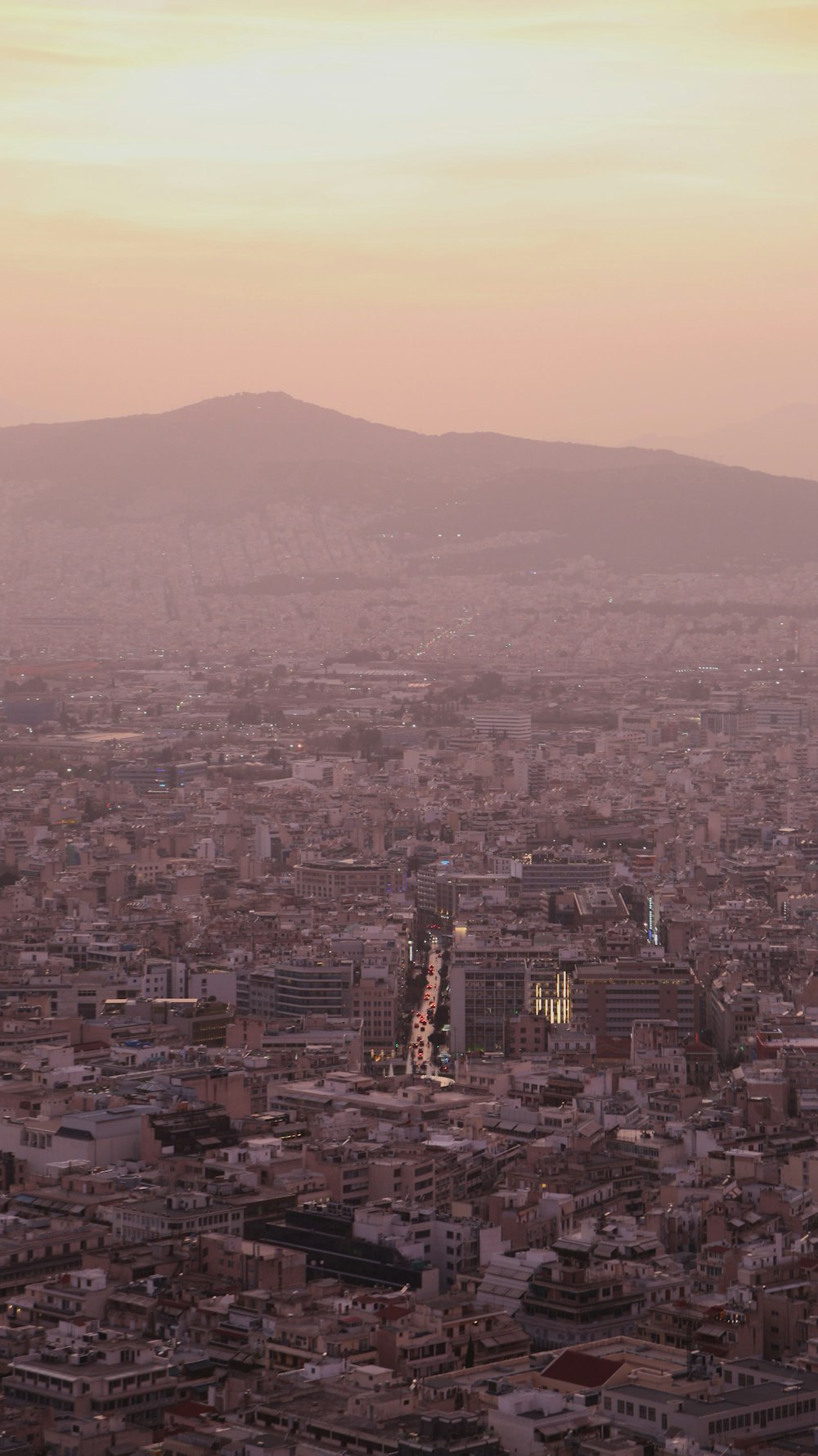 a view of a city with mountains in the background