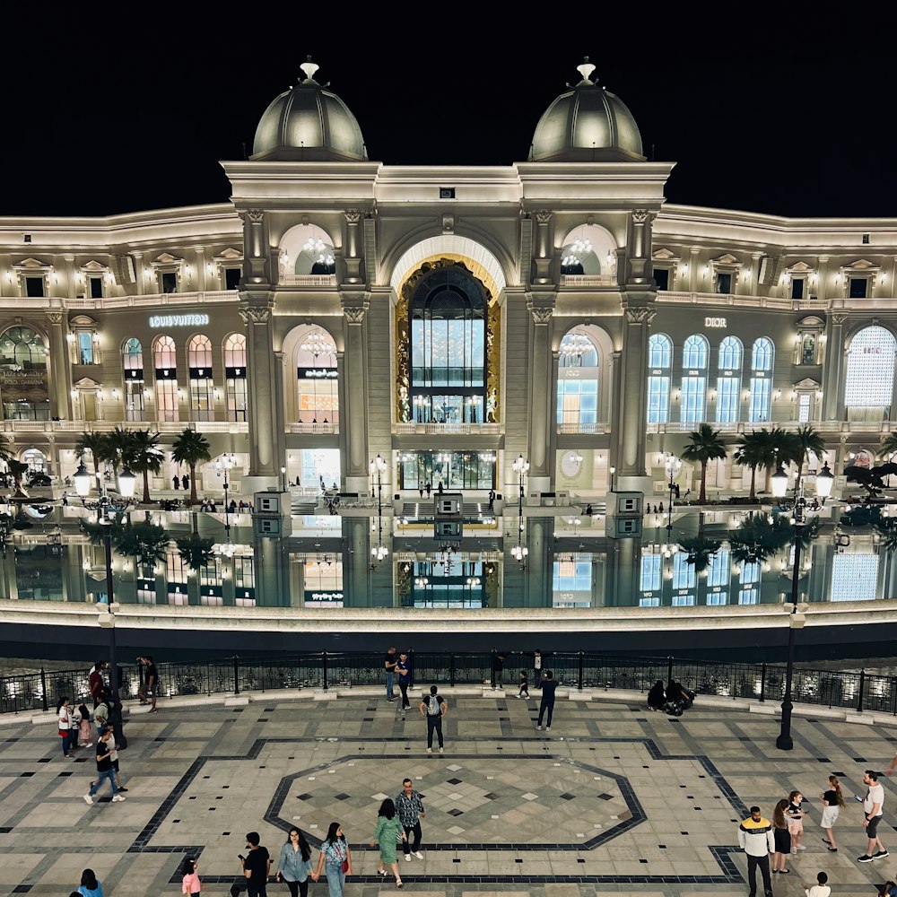 a group of people standing in front of a building