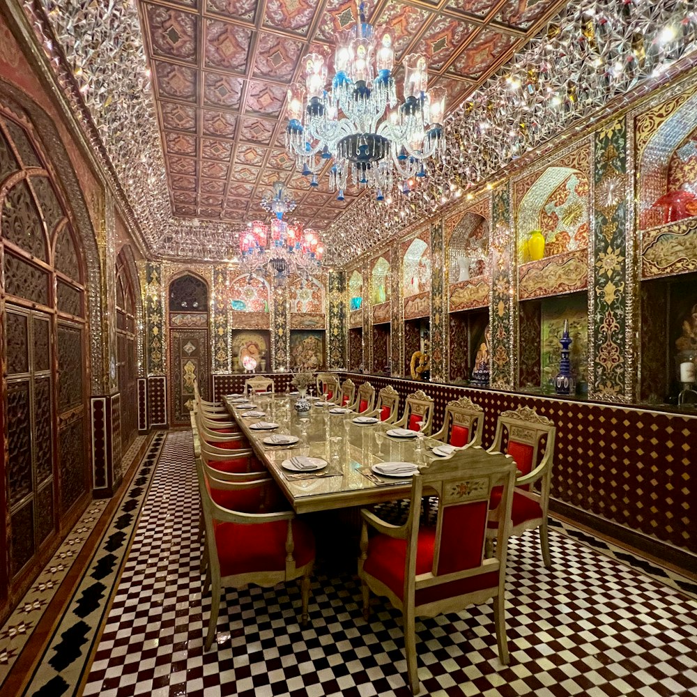 a fancy dining room with a chandelier hanging from the ceiling