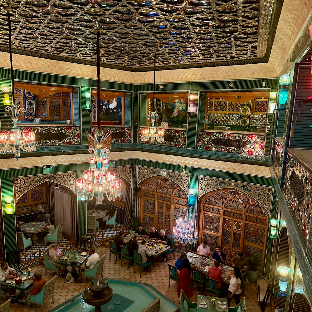 a restaurant with a chandelier hanging from the ceiling