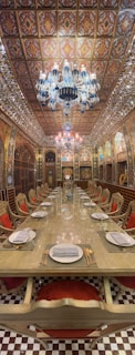 a large dining room with a fancy chandelier
