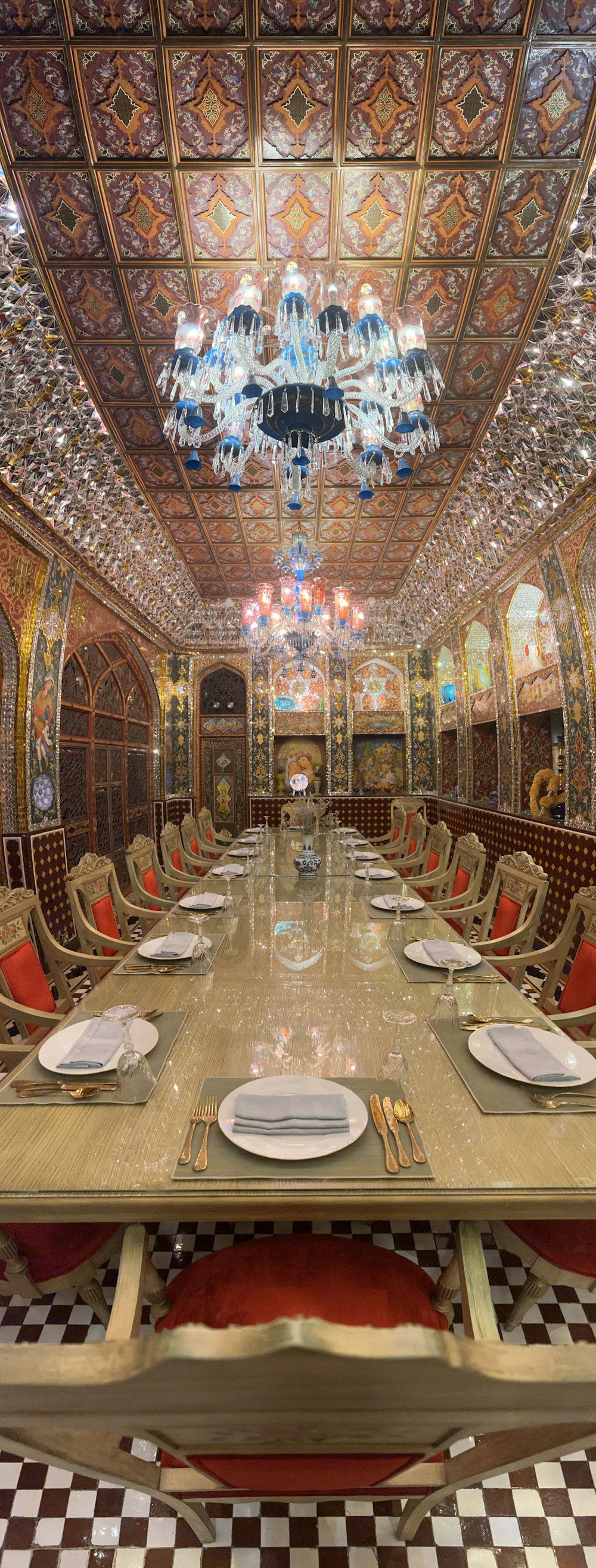 a large dining room with a fancy chandelier