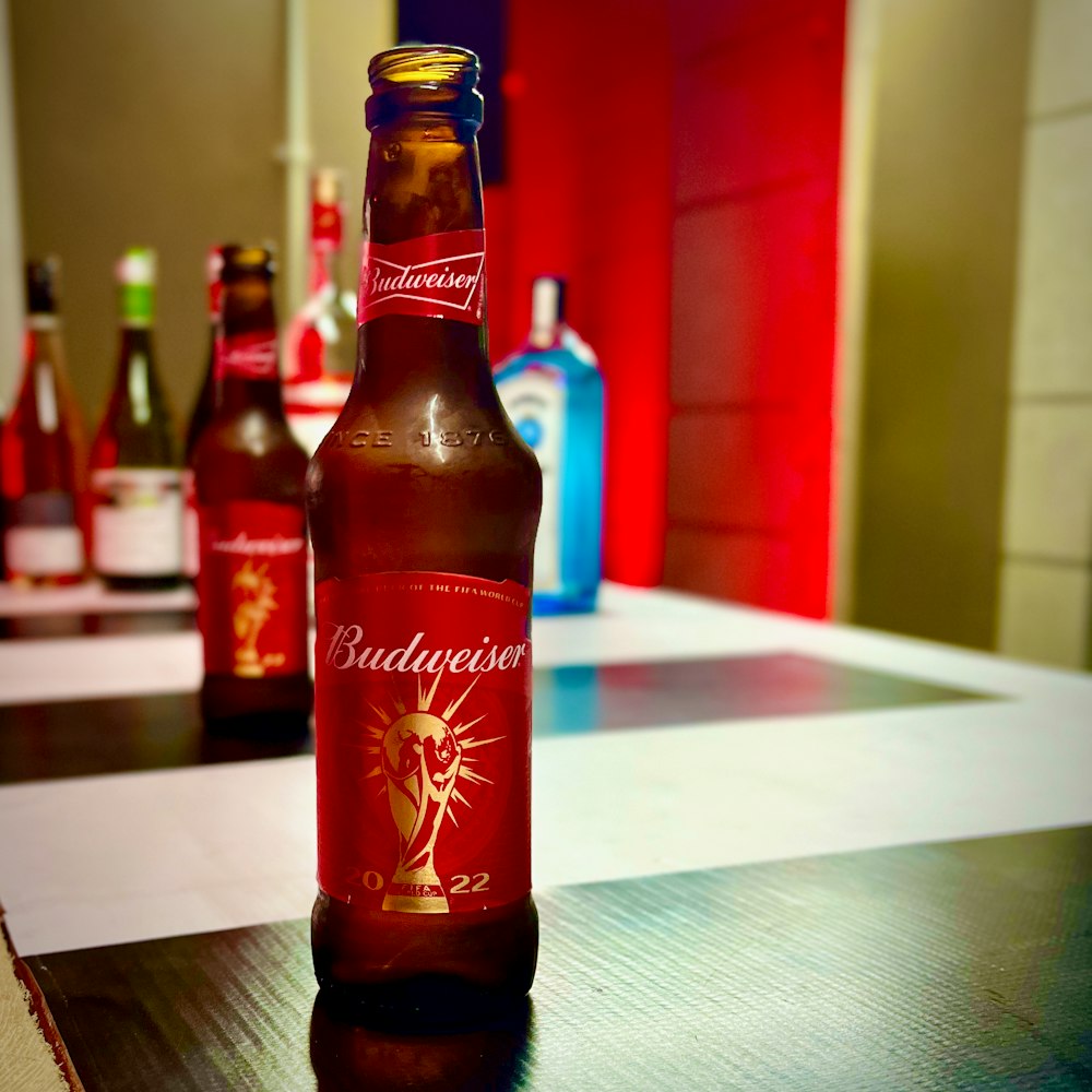 a close up of a bottle of beer on a table