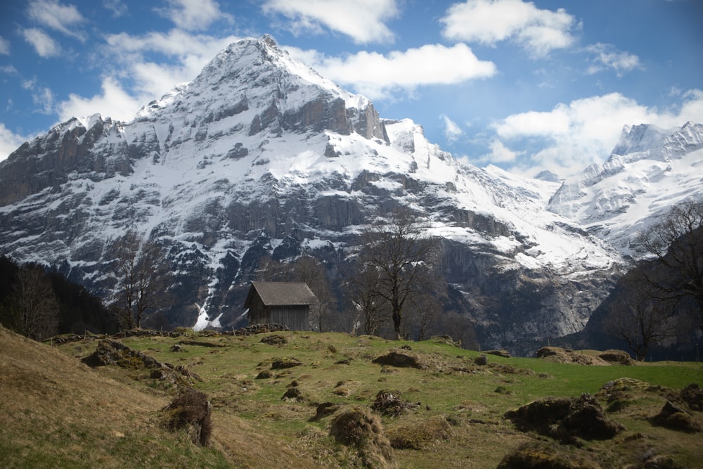 a mountain with a house in the foreground