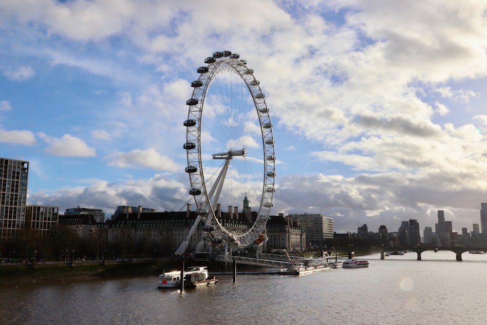 a large ferris wheel in the middle of a body of water