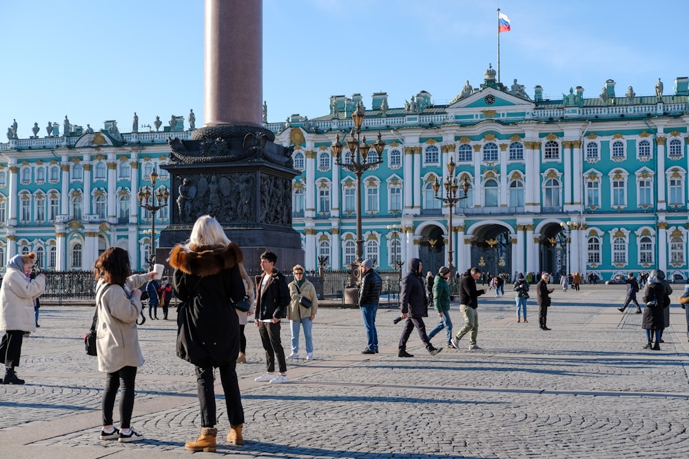 a group of people standing in front of a building