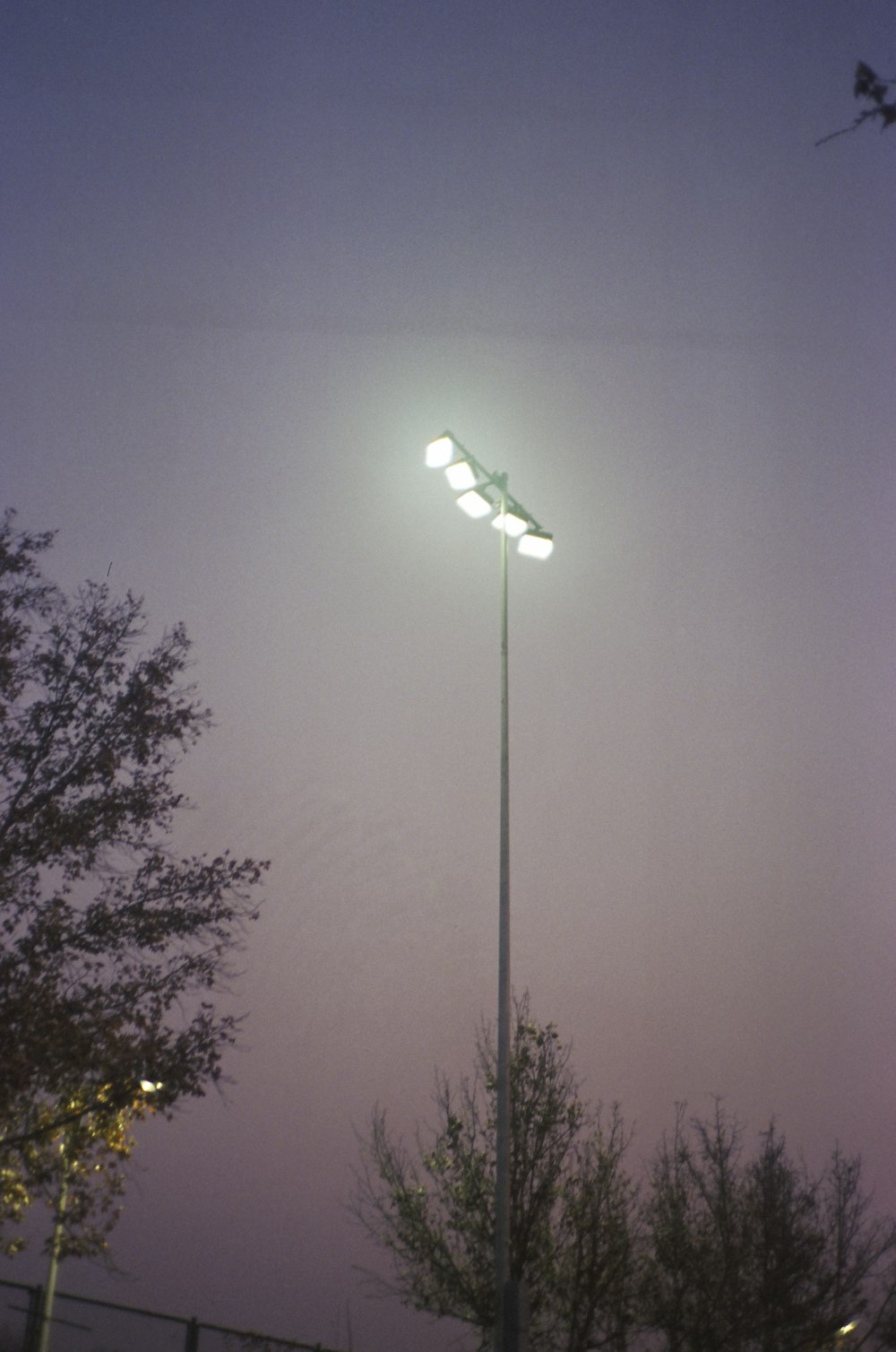 a street light is lit up at night