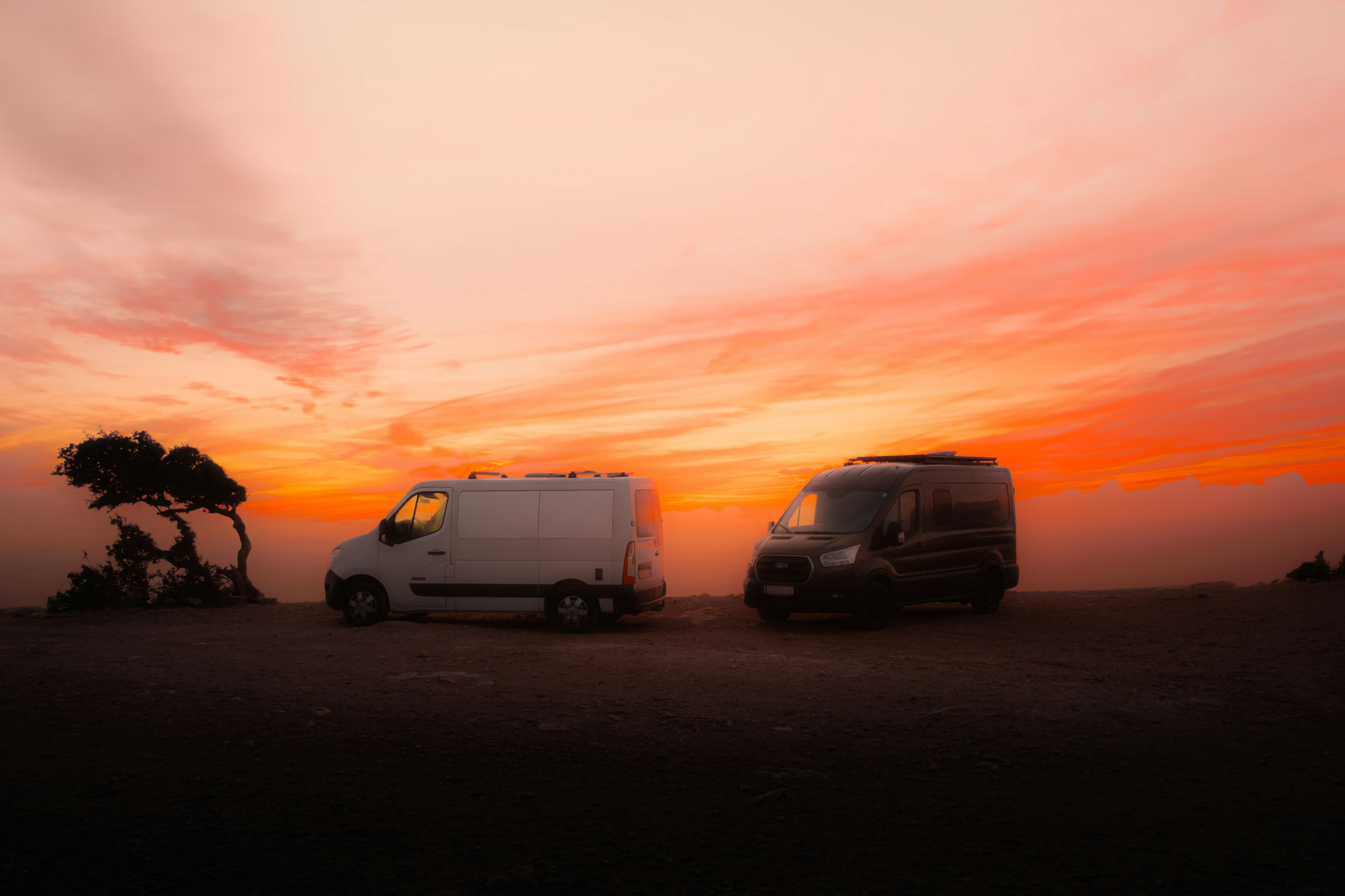 A couple of trucks parked next to each other - Free Photo on Unsplash