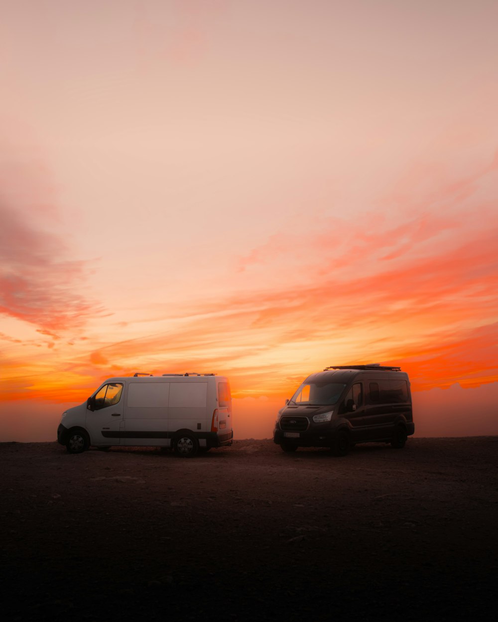 a couple of vans parked next to each other