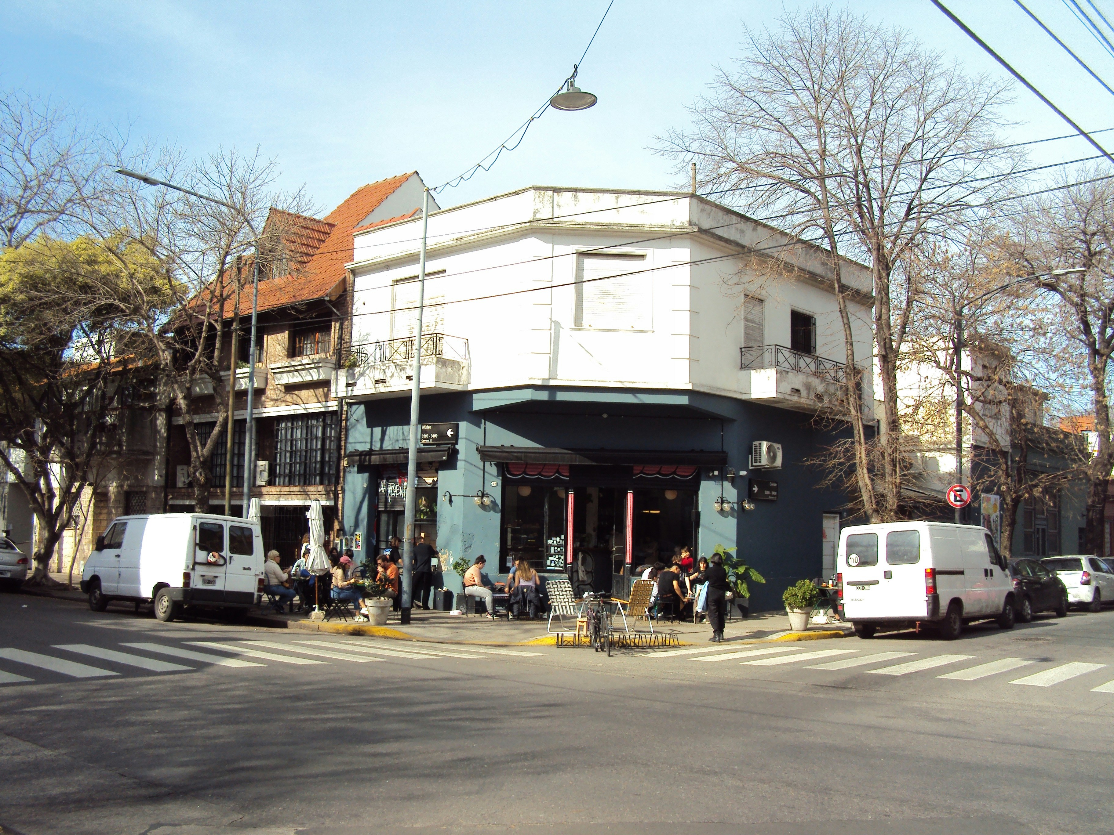 a group of people standing outside of a building