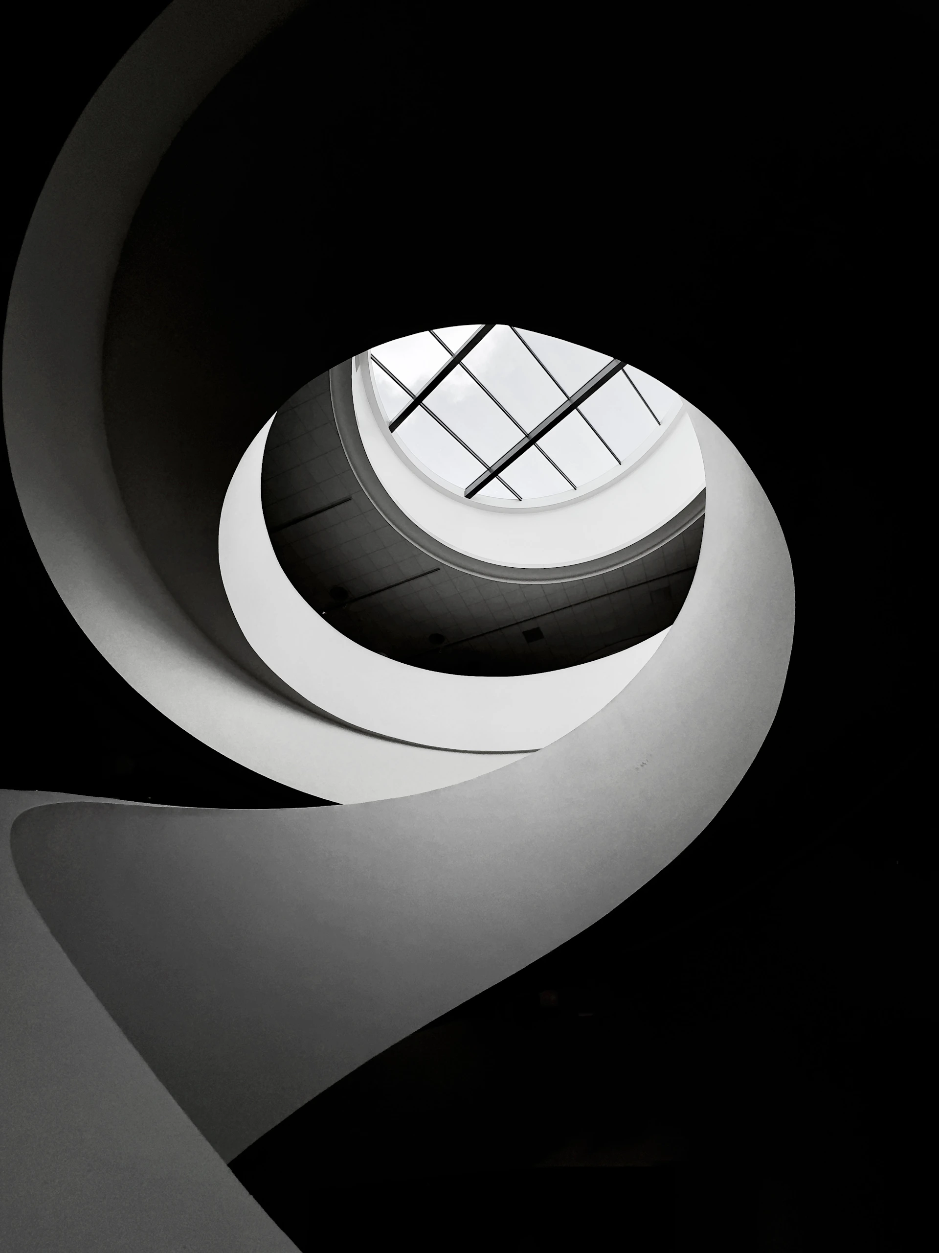 a black and white photo of a circular window