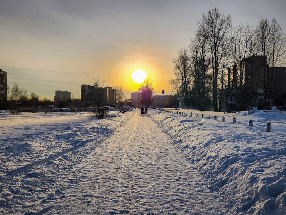 a person walking down a snow covered road