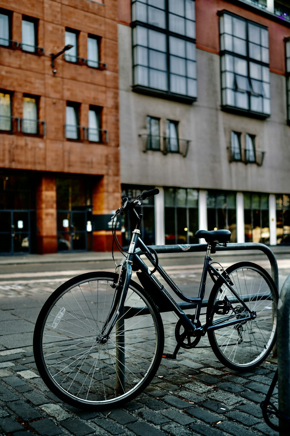 a bicycle parked on the side of the street