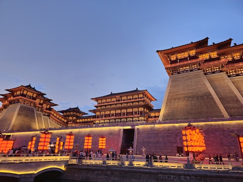 a group of people standing outside of a building
