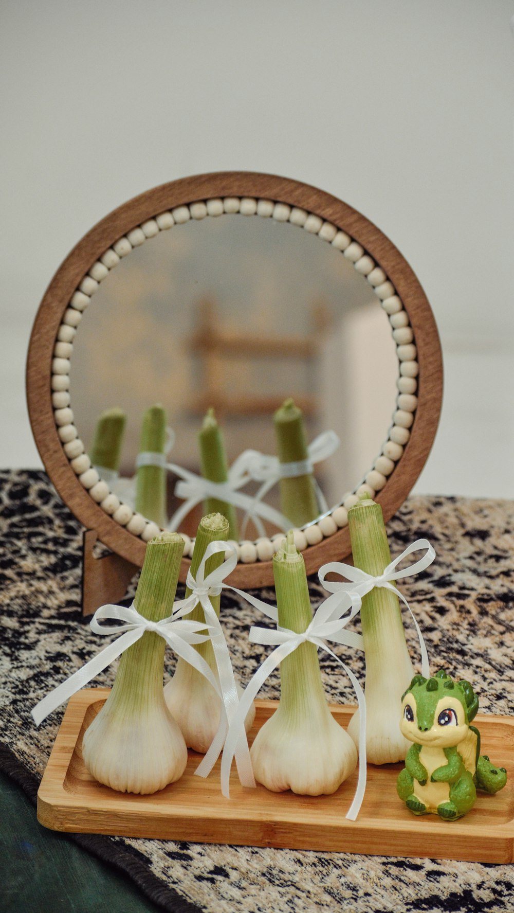 there are onions and garlic on a cutting board