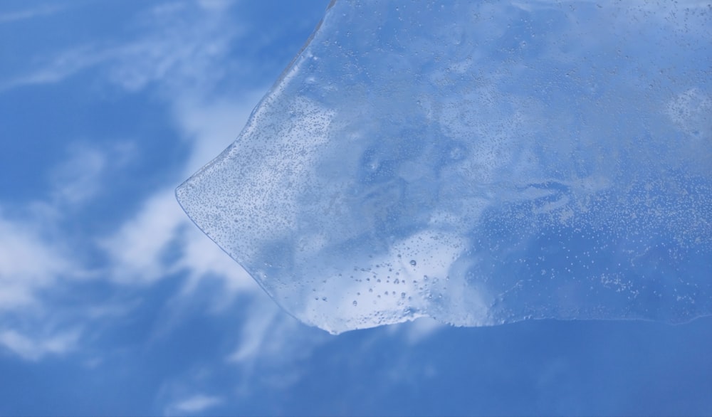 a close up of a piece of ice on a sunny day