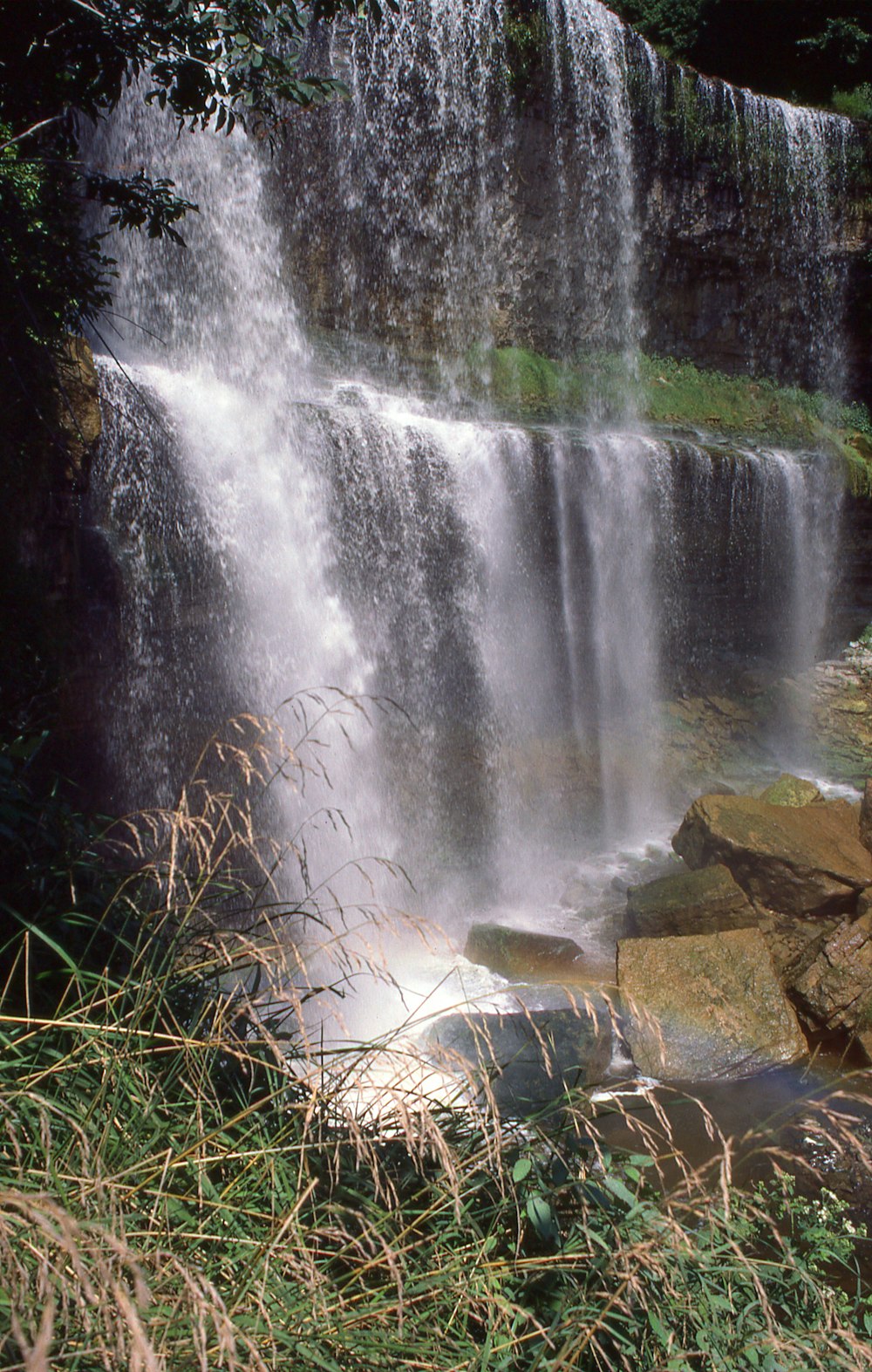 a large waterfall with water cascading over it