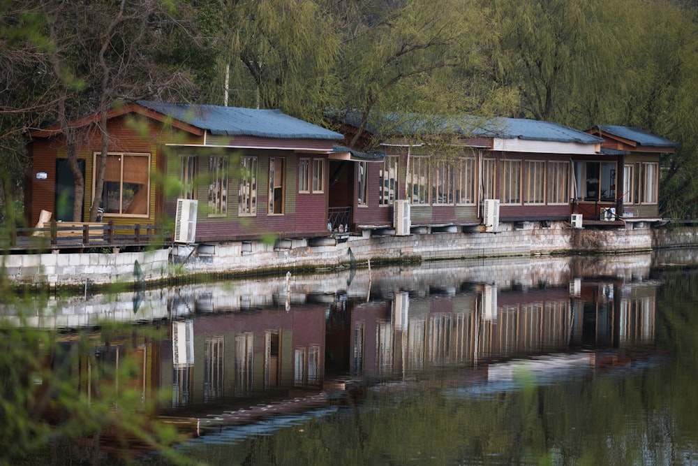 a row of houses sitting next to a body of water