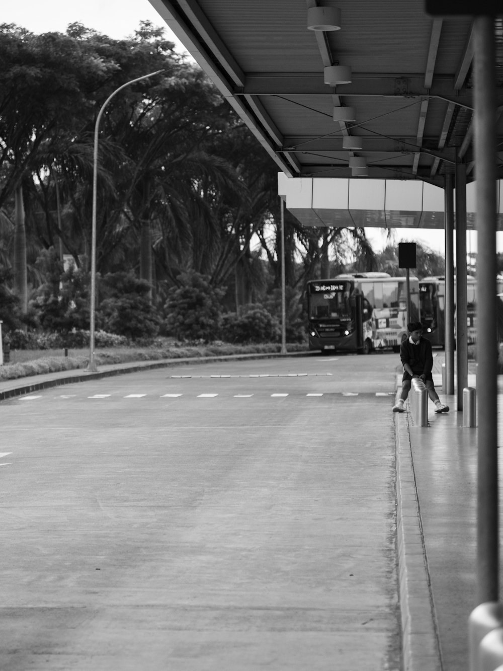 a black and white photo of a person on a skateboard