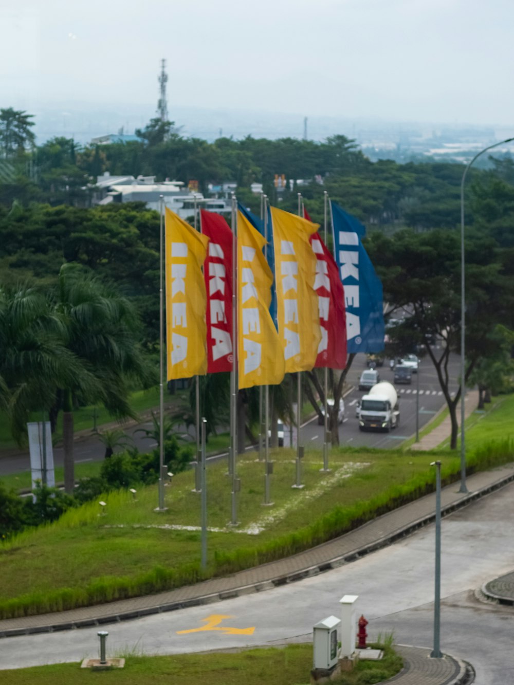 a bunch of flags that are on the side of a road