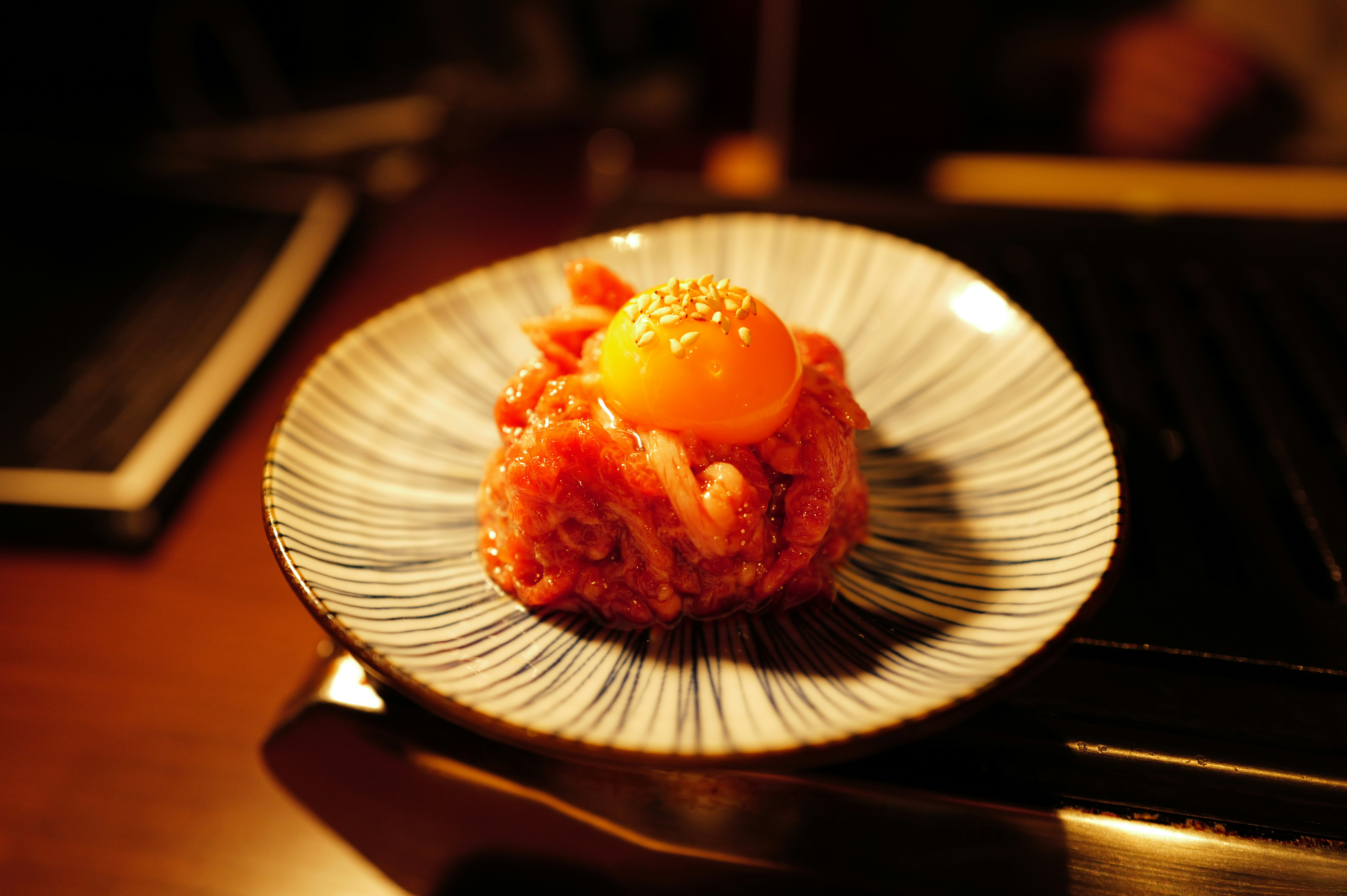 a white plate topped with food on top of a wooden table