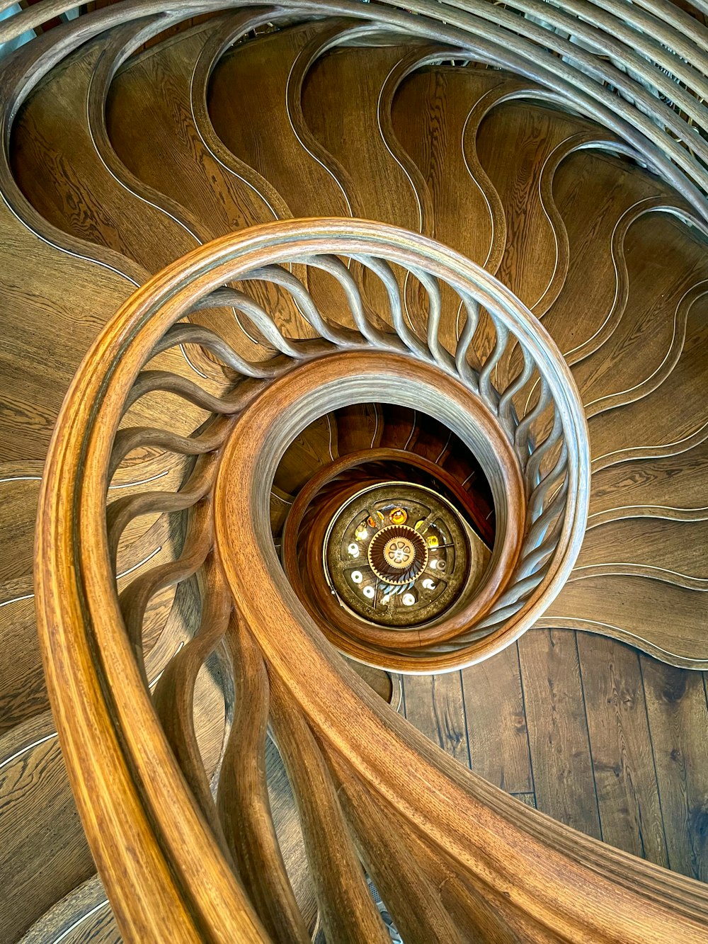a spiral wooden staircase in a building