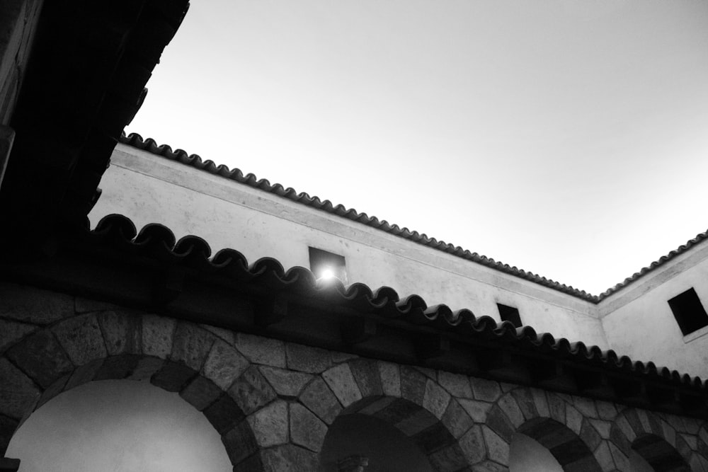 a black and white photo of the roof of a building