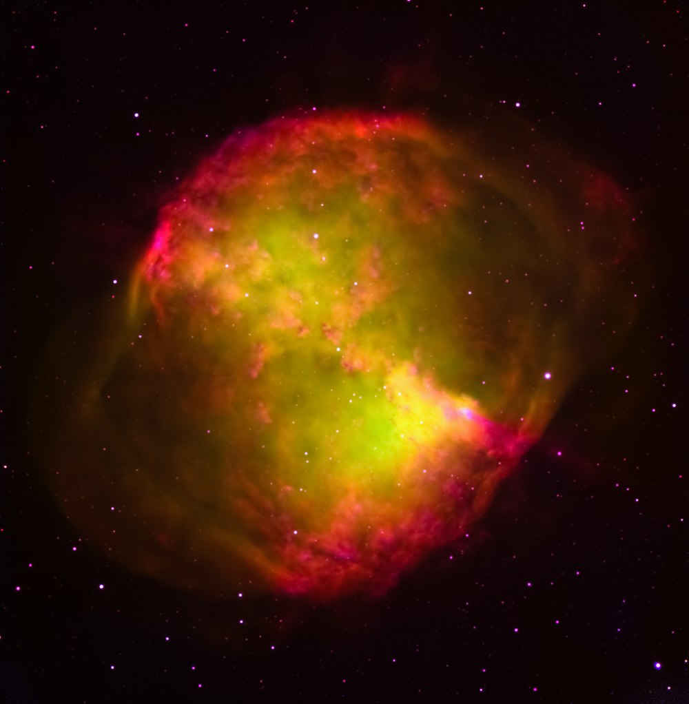a bright green and red object in the sky