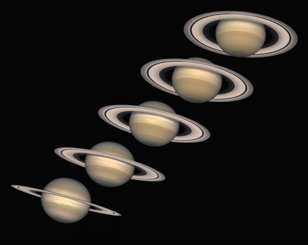 a group of saturns flying through the sky