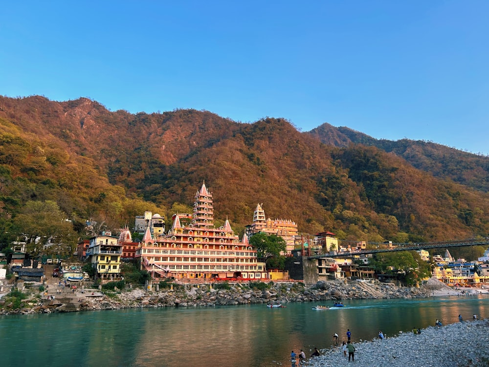 a scenic view of a mountain town with a river running through it