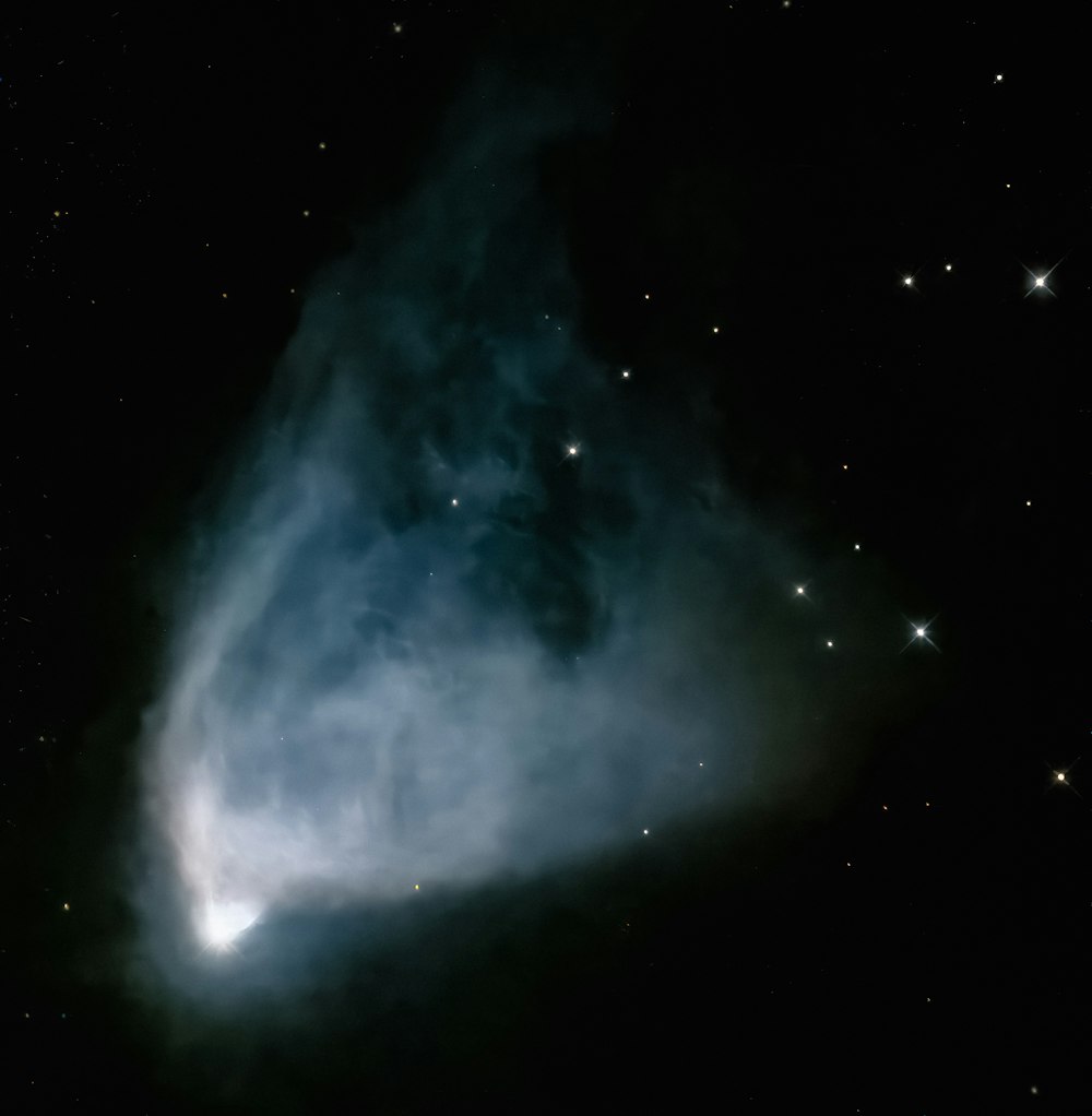 a very large cloud in the middle of a night sky