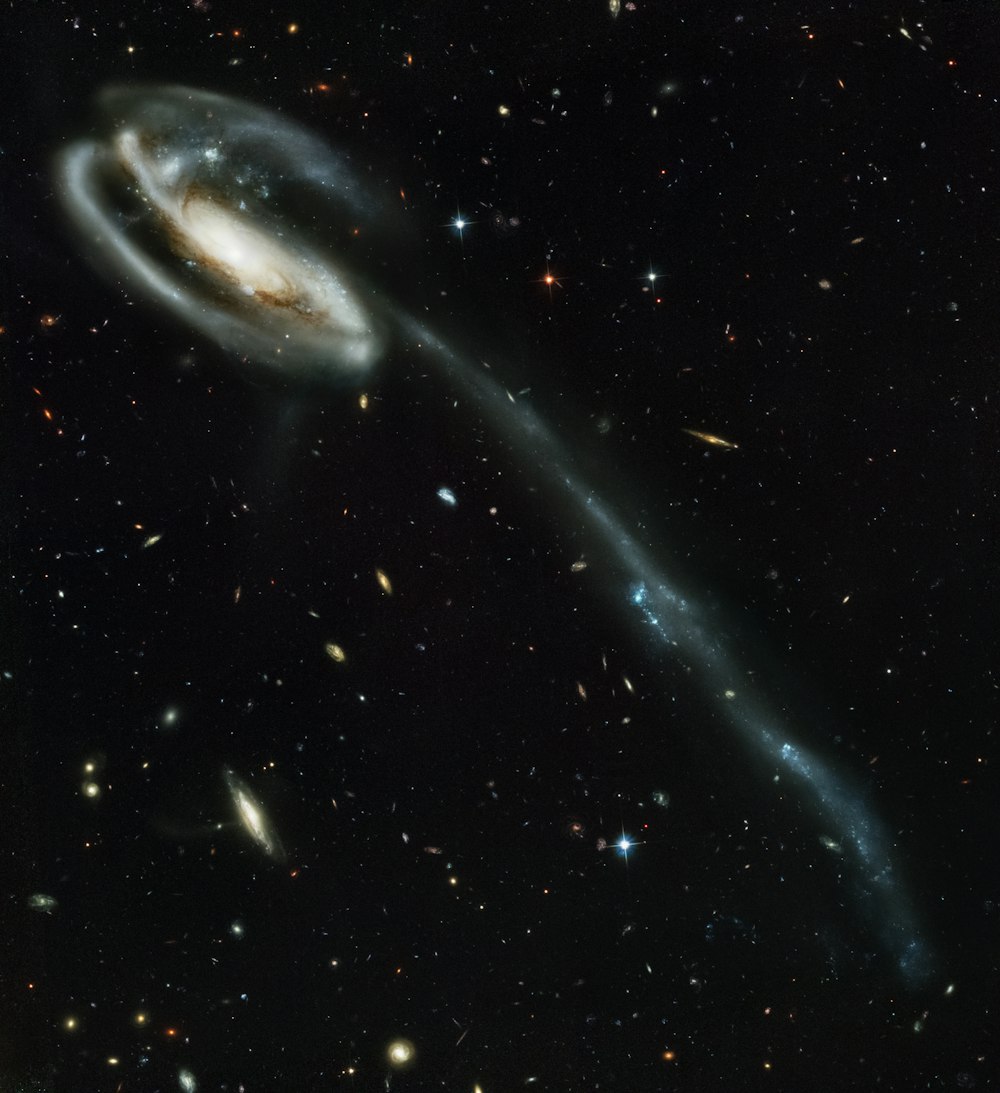 an image of a spiral galaxy in the night sky