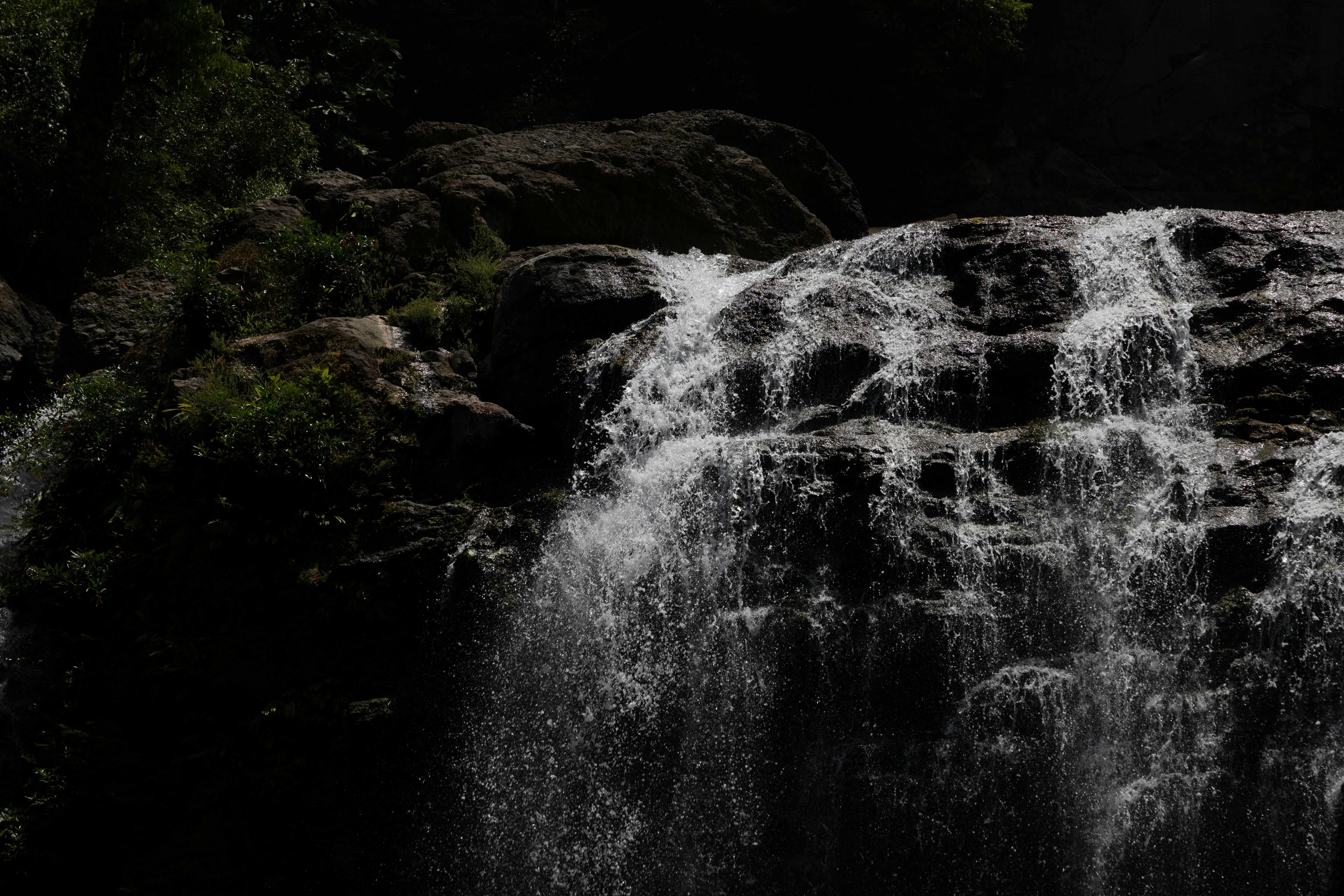 a large waterfall with lots of water coming out of it