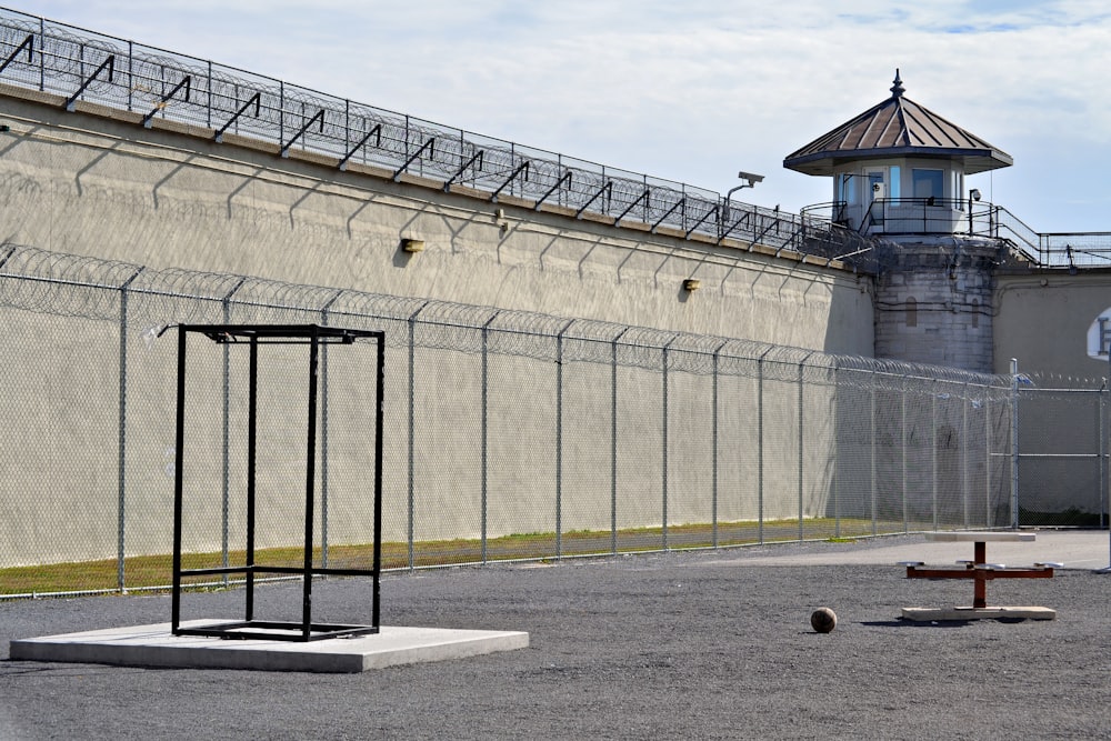 a jail cell with a cross on the ground