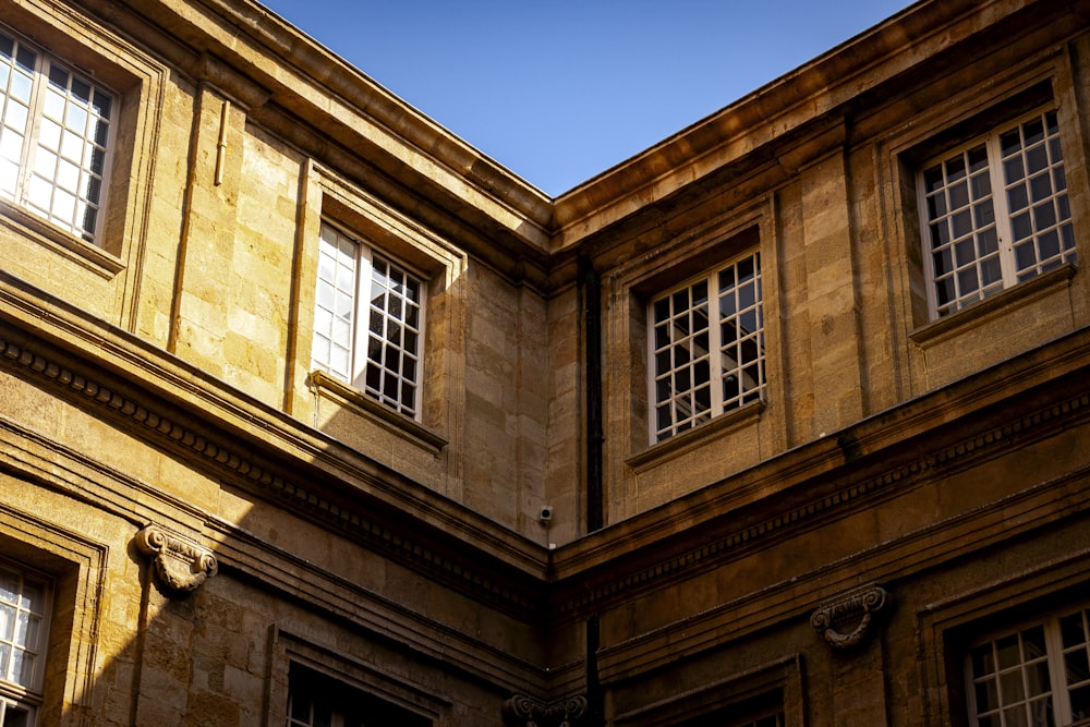 a building with windows and a clock on the side of it